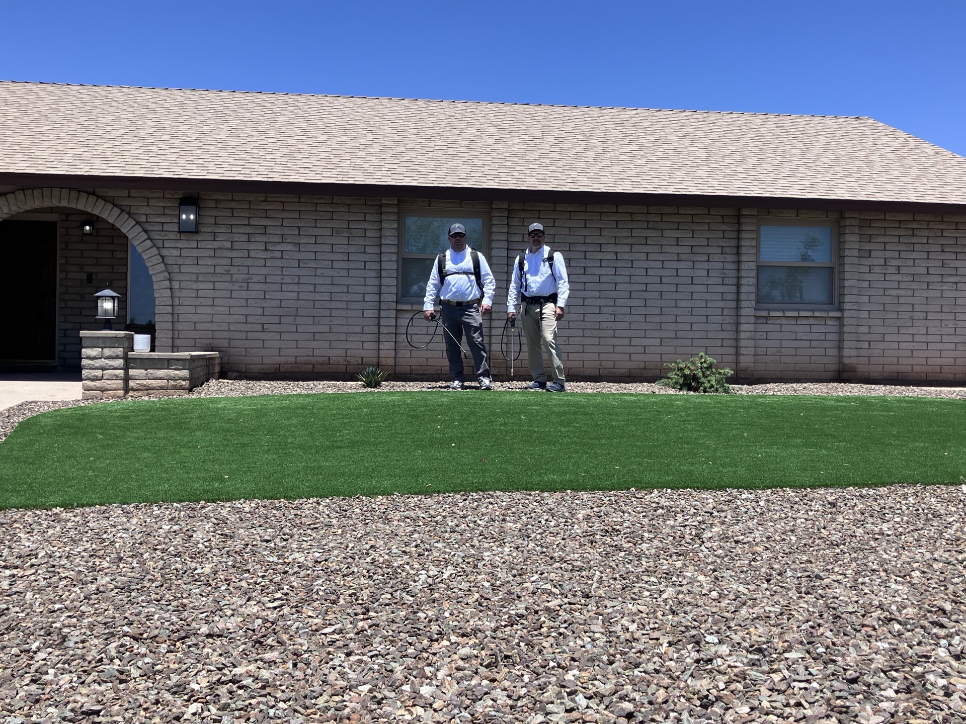 Pest Free AZ technicians ready to treat a Mesa home